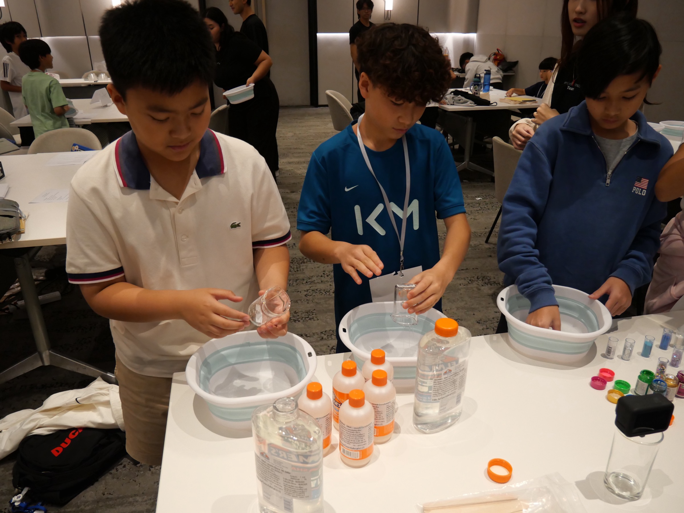 Children doing hands-on science experiment at camp